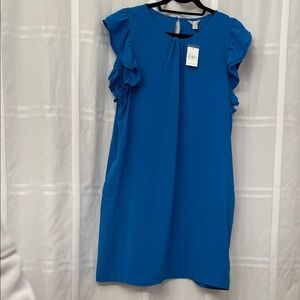 Royal blue short sleeve ruffle dress with side pockets.